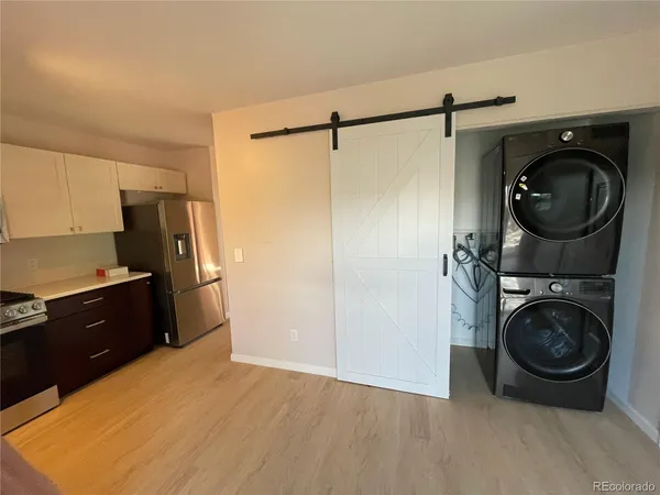 a kitchen with a washer and dryer