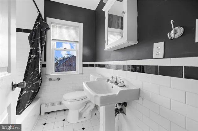 a bathroom with a shower and a tub