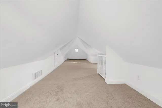 a view of a hallway with staircase