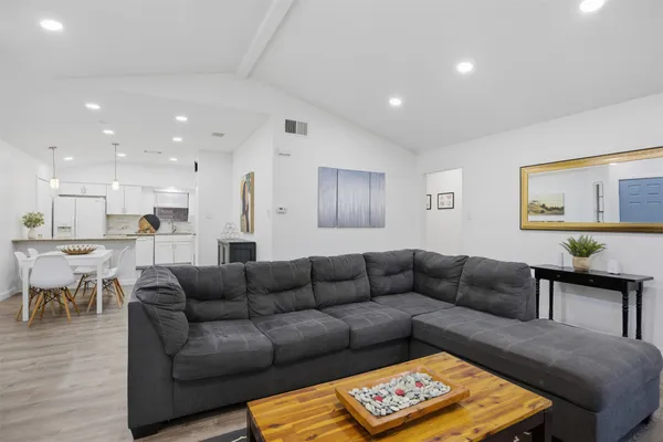 a living room with furniture and a rug