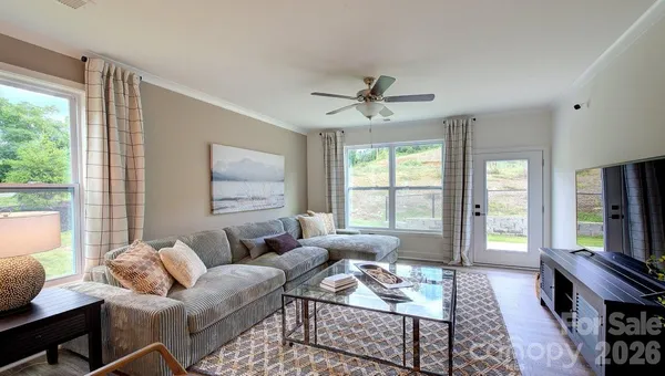 a living room with furniture and a window