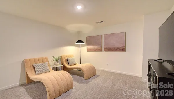 a hotel room with two beds and painting on the wall