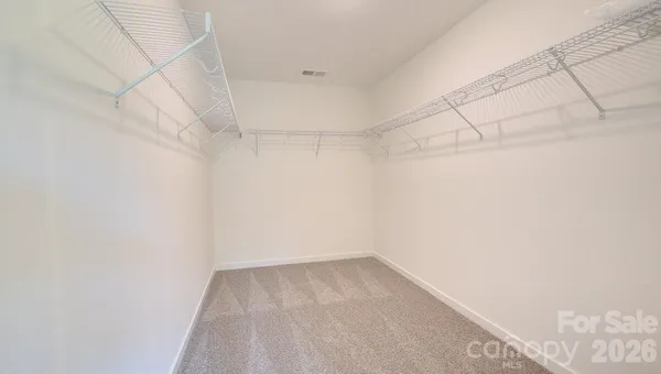 a view of a room with racks on the wall