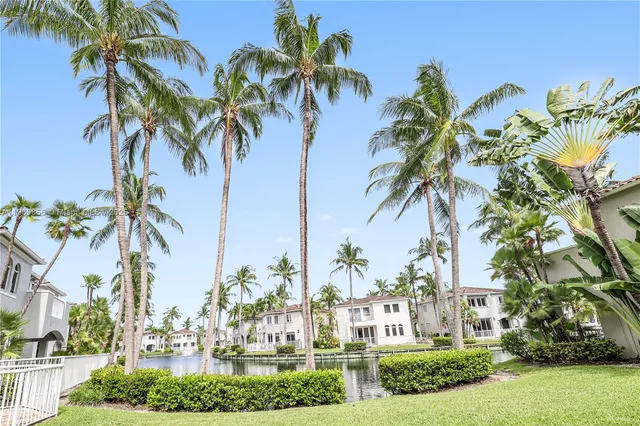 an aerial view of a house with a yard and potted plants