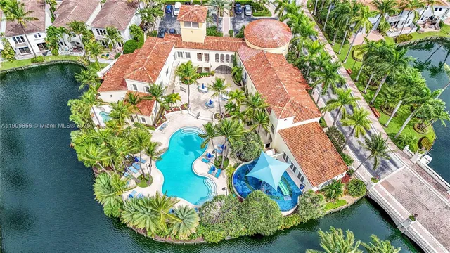 a view of a sign board with a big yard and potted plants