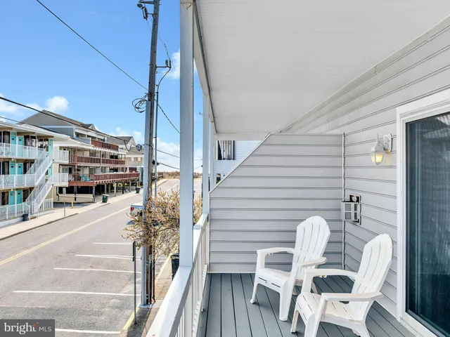 a view of a balcony with wooden floor