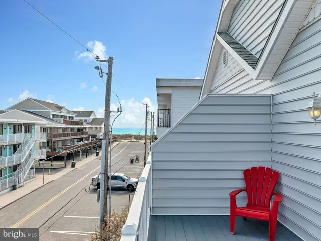 a bedroom with two beds and a dresser