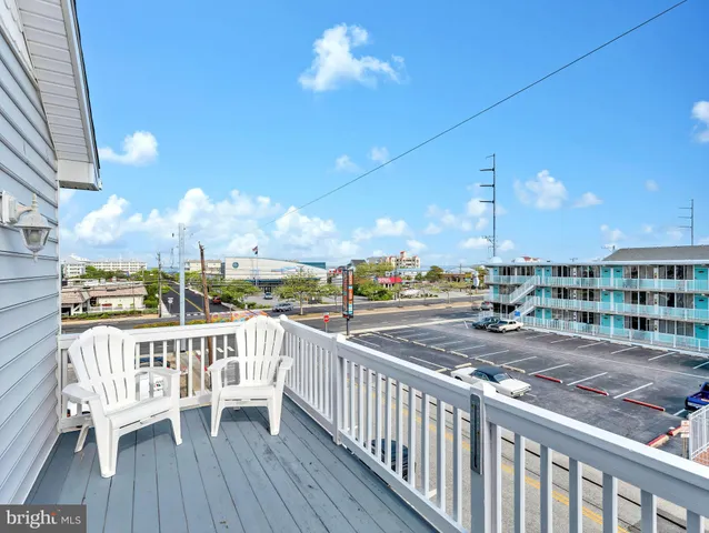 a bedroom with a bed and a lamp with window