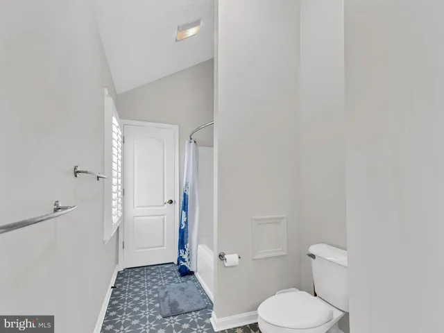 a view of a porch with a door and a floor to ceiling window