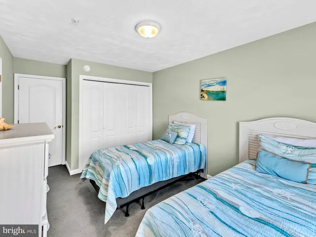 a kitchen with granite countertop a sink stove and refrigerator