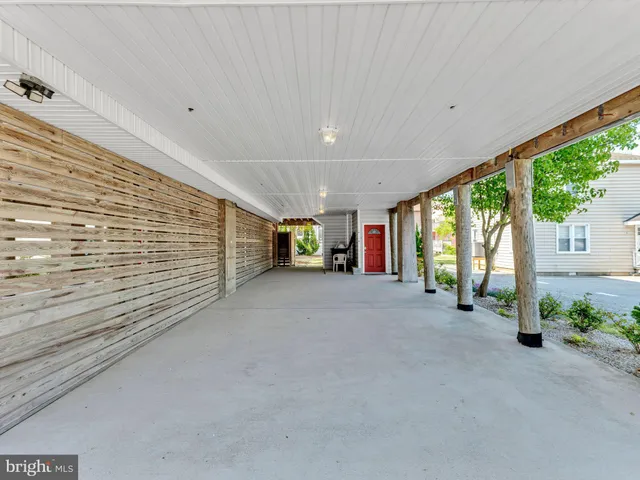 a spacious bedroom with a large bed and a large window