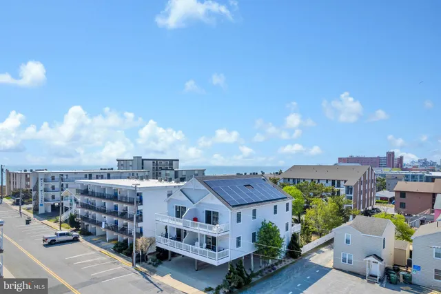 a bedroom with bed and wooden floor