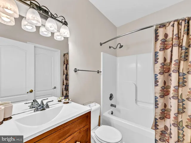 a bedroom with a bed and a lamp