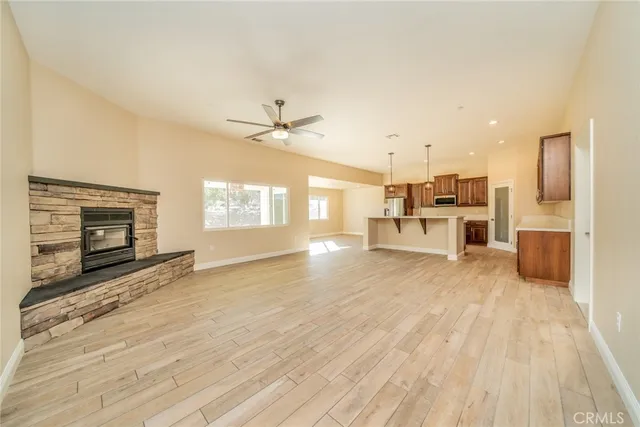 a view of a kitchen with a stove cabinets and wooden floor