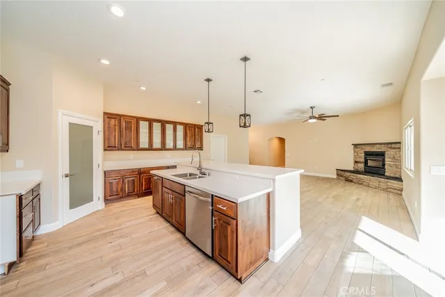 a kitchen with stainless steel appliances a stove and a sink