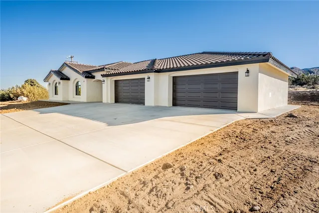 a front view of a house with a garage