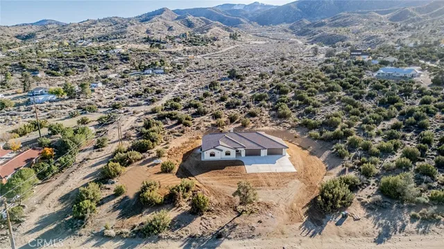 an aerial view of residential house with outdoor space