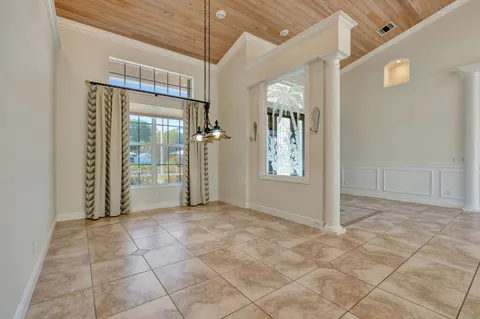 a view of a hallway with a kitchen