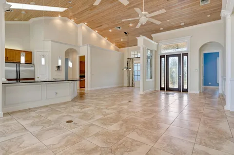 a kitchen with stainless steel appliances granite countertop a stove sink and cabinets