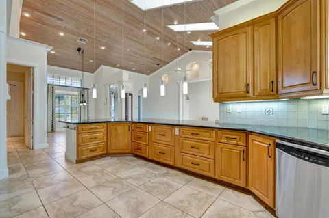 a spacious bathroom with a double vanity sink tub and window