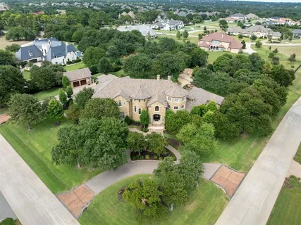 an aerial view of residential houses with outdoor space and river