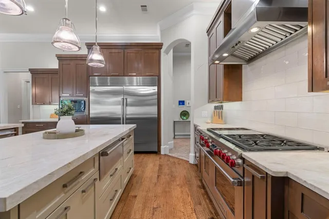 a kitchen that has a sink and a stove