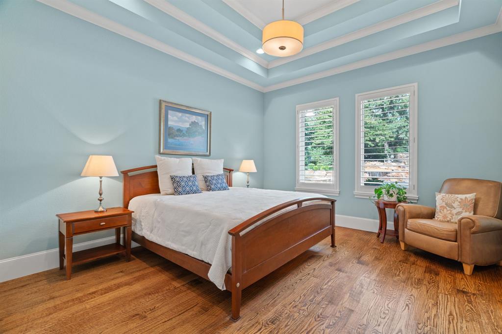 1908 Point De Vue Flower Mound, TX 75022 - Photo 22 of 40 a bed room with a bed and a chair