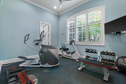 a room with gym equipment and a large window