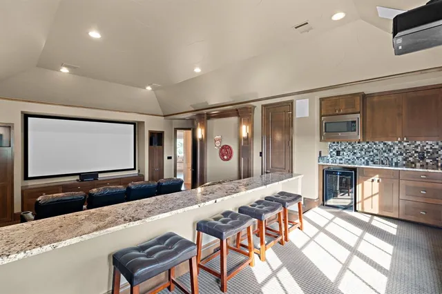 a living room with fireplace furniture and a flat screen tv