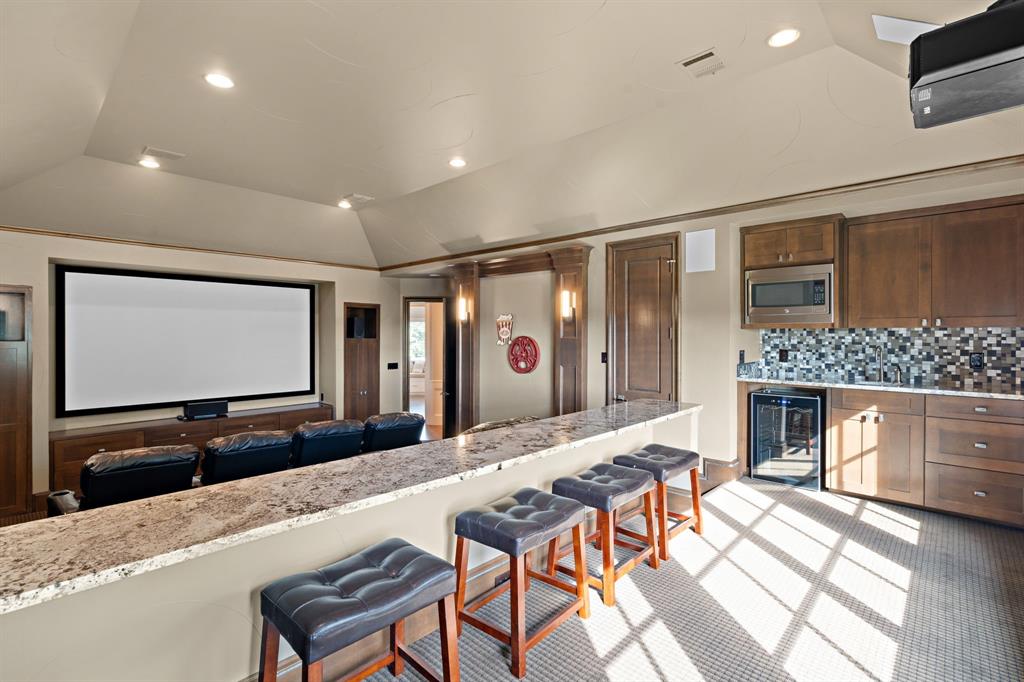 1908 Point De Vue Flower Mound, TX 75022 - Photo 26 of 40 a living room with fireplace furniture and a flat screen tv