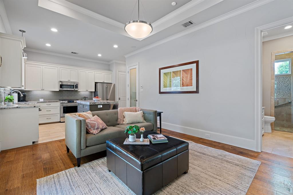 1908 Point De Vue Flower Mound, TX 75022 - Photo 30 of 40 a living room with furniture kitchen and a chandelier