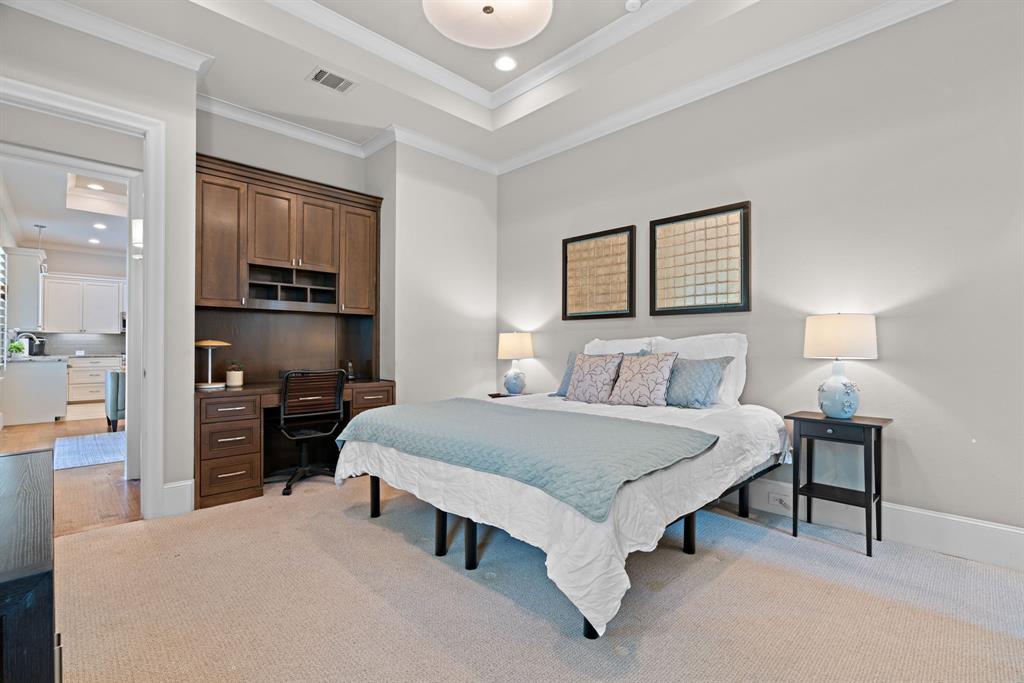 1908 Point De Vue Flower Mound, TX 75022 - Photo 31 of 40 a spacious bedroom with a bed and a flat screen tv