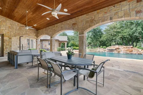 a view of an outside dining space with furniture