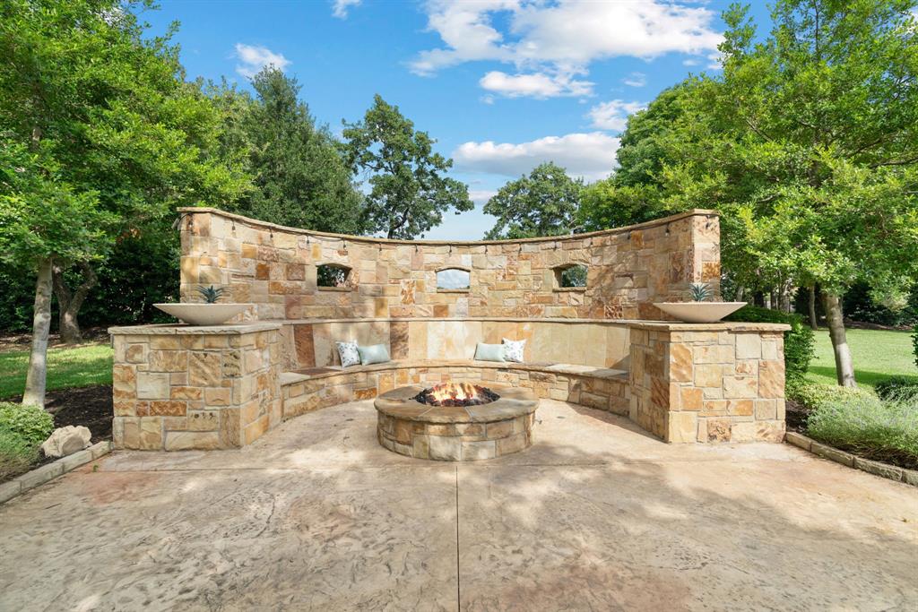 1908 Point De Vue Flower Mound, TX 75022 - Photo 38 of 40 a backyard of a house with table and chairs with wooden fence