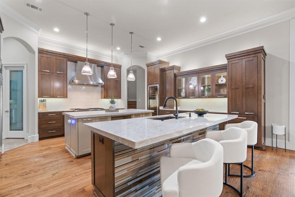 1908 Point De Vue Flower Mound, TX 75022 - Photo 8 of 40 a large kitchen with a table and chairs