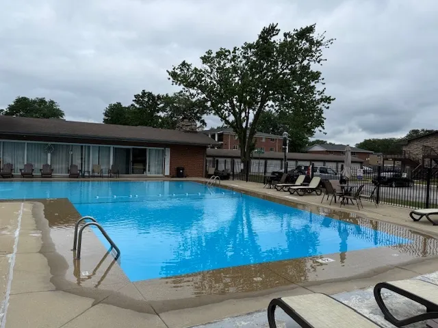a view of a swimming pool with a lounge chairs