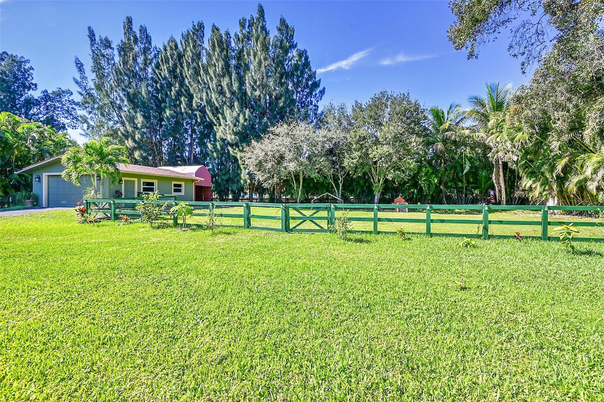 Undisclosed Address Southwest Ranches, FL 33331 - Photo 13 of 24 a view of a park with trees and grass
