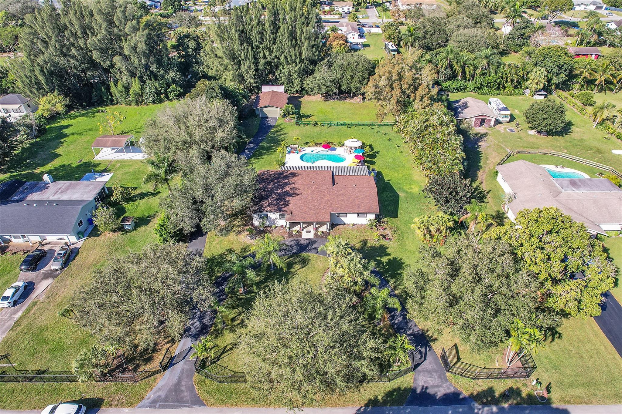 Undisclosed Address Southwest Ranches, FL 33331 - Photo 15 of 24 an aerial view of a house with a yard