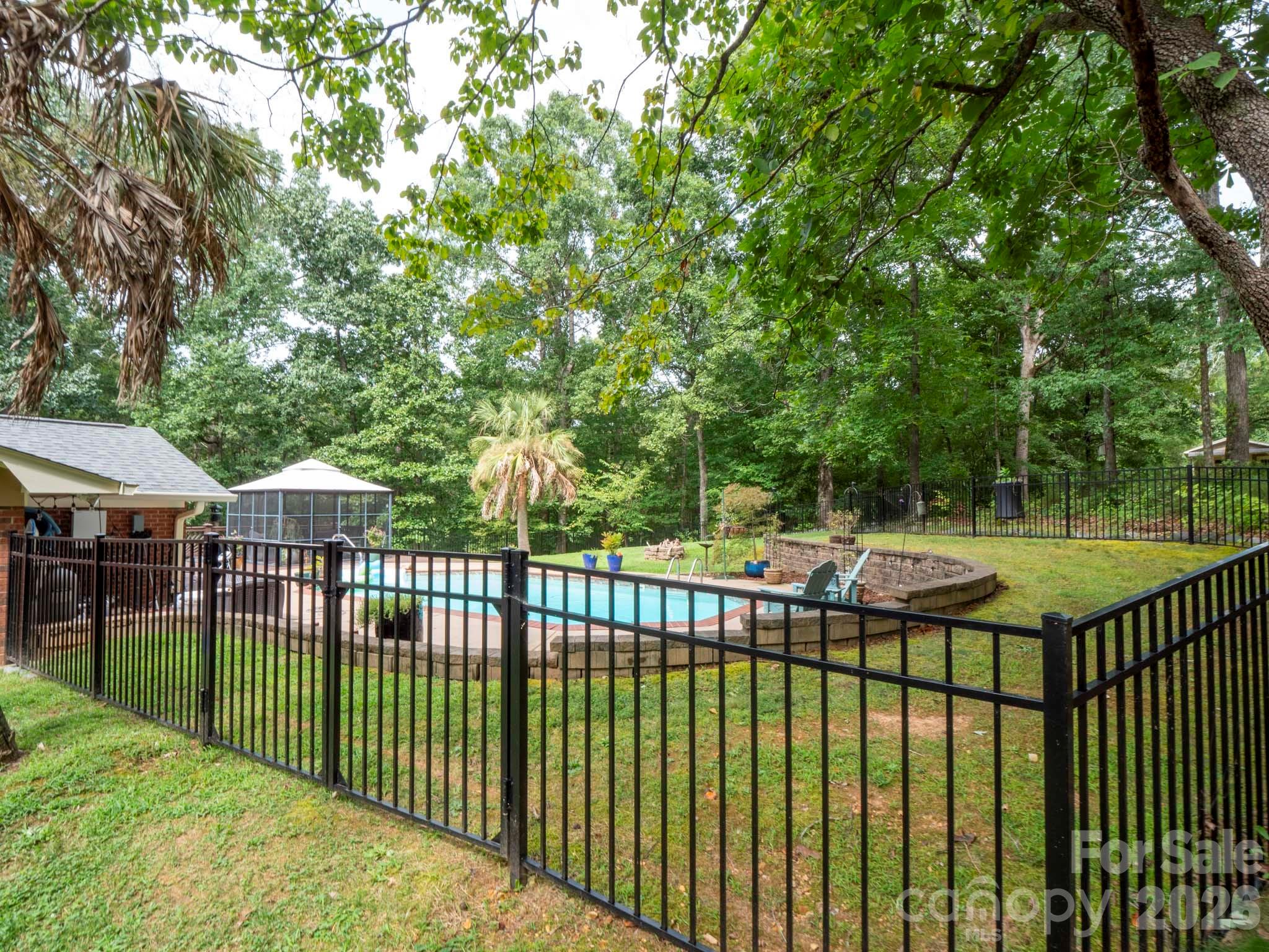 8720 Unionville-Brief Road Monroe, NC 28110 - Photo 6 of 35 a view of a wrought iron fences in front of house