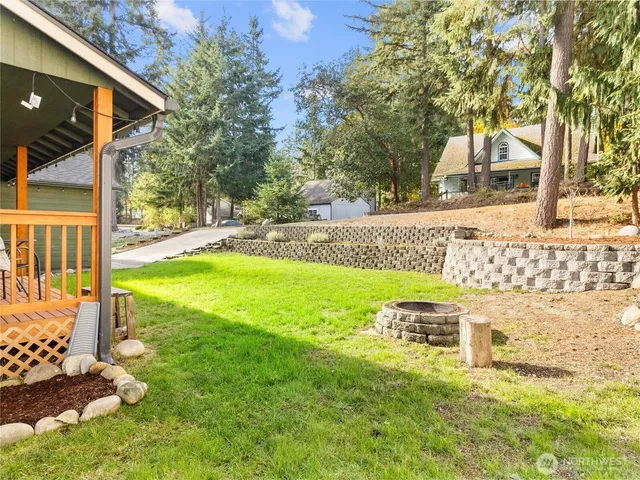 a view of an house with backyard porch and sitting area