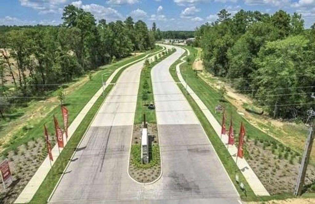 248 Seven Pines Willis, TX 77378 - Photo 12 of 17 a view of swimming pool with a garden