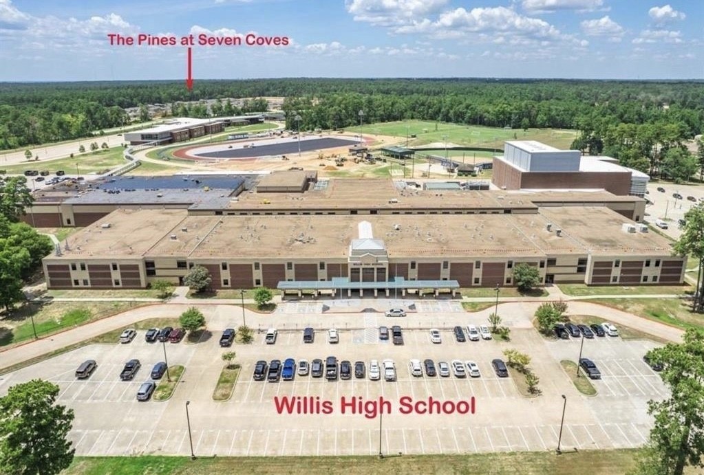 248 Seven Pines Willis, TX 77378 - Photo 13 of 17 a view of building with outdoor space and seating area