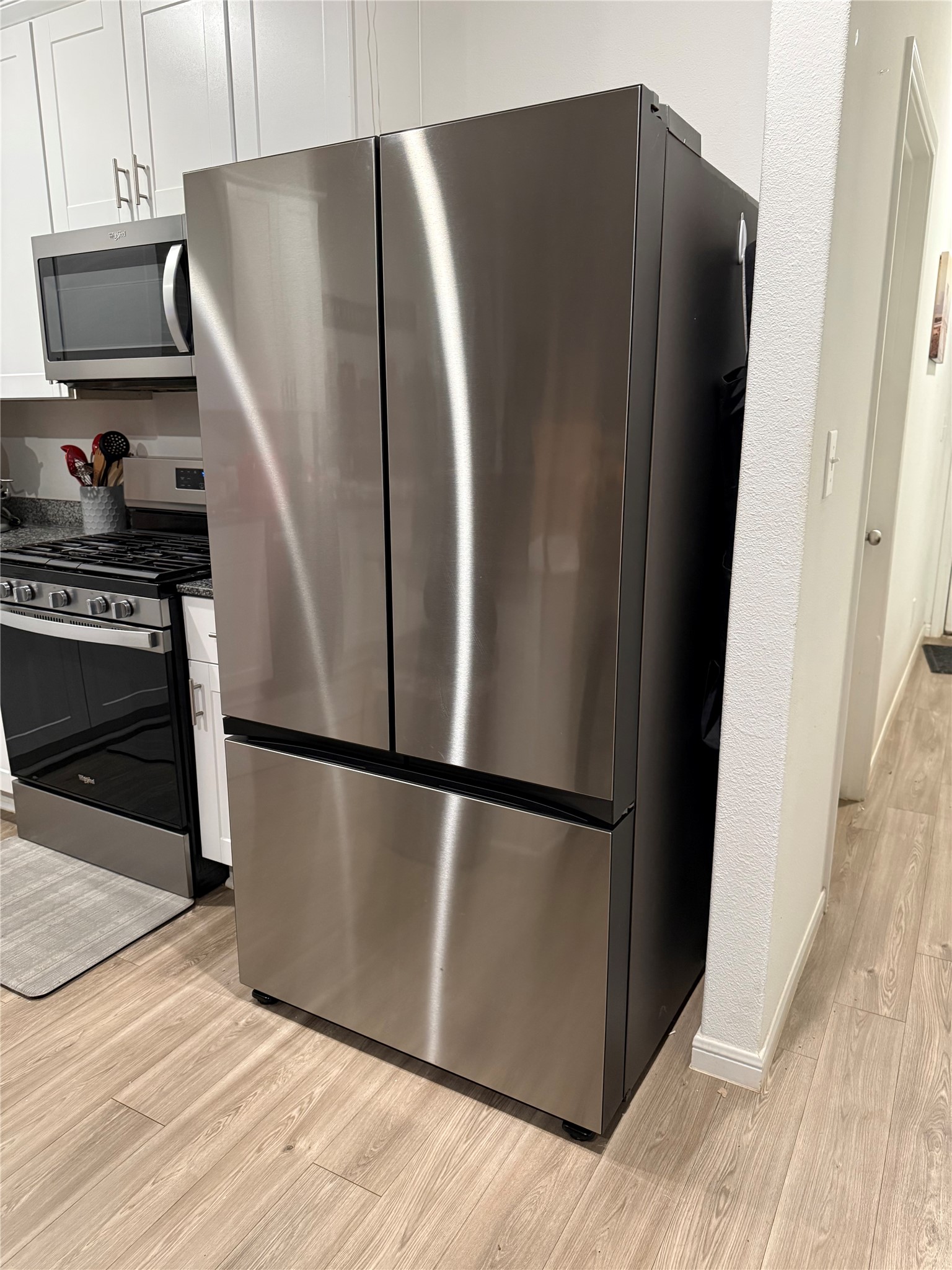 248 Seven Pines Willis, TX 77378 - Photo 15 of 17 a metallic refrigerator freezer sitting in a kitchen