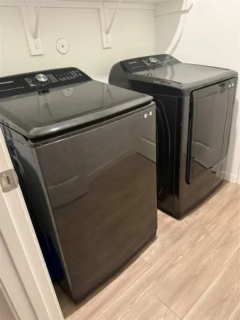 a metallic refrigerator freezer sitting in a kitchen
