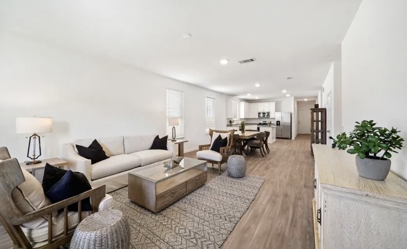 248 Seven Pines Willis, TX 77378 - Photo 2 of 17 a living room with furniture a potted plant and a table