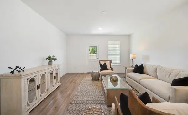 a living room with furniture and a window