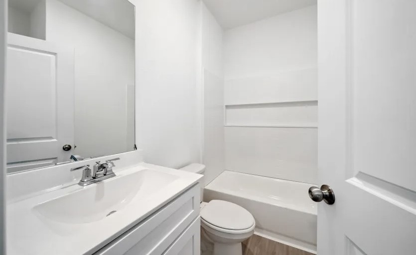 248 Seven Pines Willis, TX 77378 - Photo 10 of 17 a bathroom with a sink toilet and shower