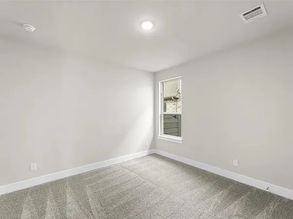 an empty room with a empty space and window
