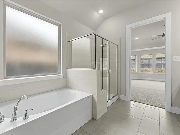 a bathroom with a bathtub and a shower