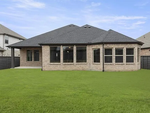 a view of a house with a garden
